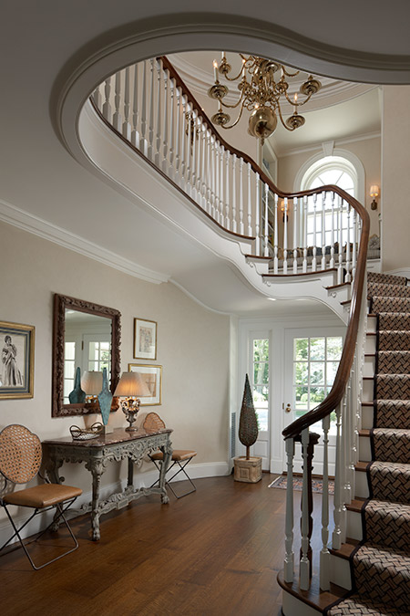 elegant stairway leading to second floor of home